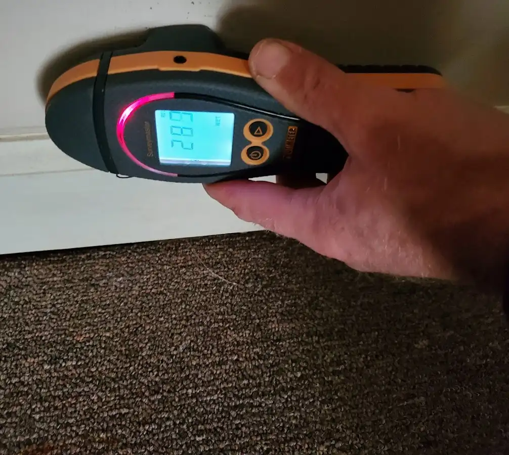 Moisture detection at baseboard during Storm Damage Restoration in Delanco